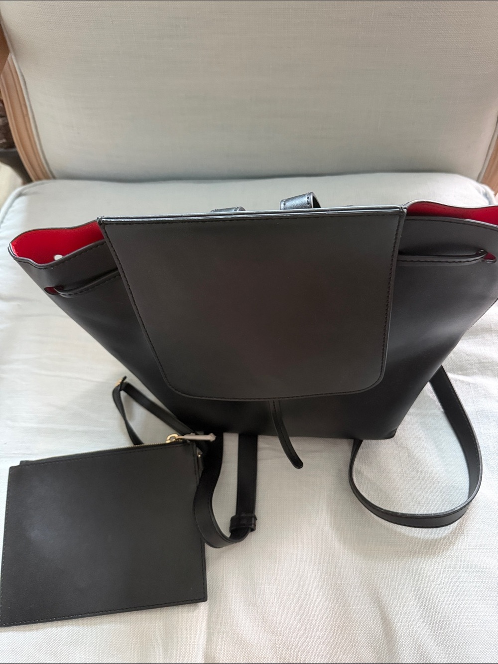 Black Leather Backpack with Red Interior and Zipper Clutch